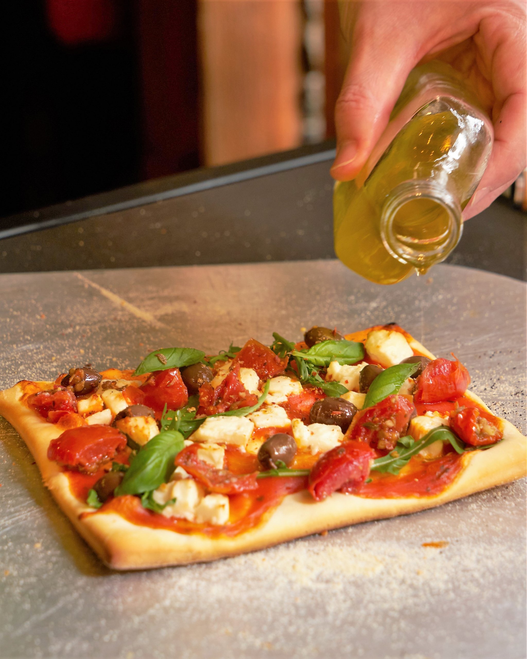 Recept: pizza met tomaten frito, feta en olijven
